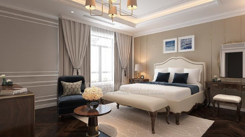 Sắp xếp nội thất phòng ngủ tân cổ điển đẹp, sang trọng nổi bật với sắc trắng điểm nhấn từ bộ đôn, giường bọc nệm gỗ óc chó tự nhiên. Thiết kế phòng ngủ biệt thự